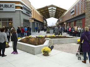 Shoppers mill about the new Tanger Outlets in Kanata.