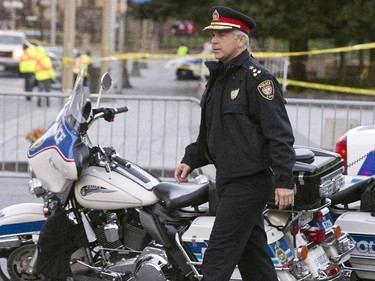 Ottawa Police chief Charles Bordeleau visited the scene Oct 23 at the Cenotaph where a soldier was shot dead Oct 22. The gunman was later killed when he stalked the halls of Parliament Hill.