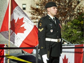 Cpl. Daniel Germaine stands at the Tomb of the Unknown Soldier on Friday, Oct. 24, 2014.