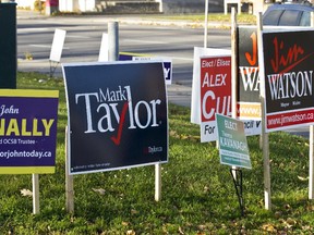 Election signs at the intersection of Richmond Rd and Woodroffe Ave Oct 27th. Today is municipal election day for voters to select a mayor and councillors. (Pat McGrath / Ottawa Citizen)