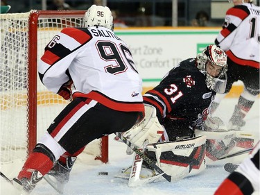 67 Dante Salituro, left, scores the 67's first goal on Brent Moran in the first period as the Ottawa 67's take on the Niagara Ice Dogs in their home opener at the renovated TD Place arena.