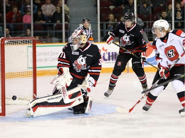 67's forward Artur Tyanulin, right, misses the open net behind Brent Moran in the first period as the Ottawa 67's take on the Niagara Ice Dogs in their home opener at the renovated TD Place arena.