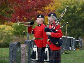 A bugler plays the Last Post at a ceremony to commemorate the 10th anniversary of the RCMP National Memorial Cemetery at Beechwood Cemetery in Ottawa on Saturday, October 19, 2014.