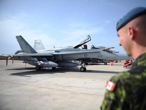 A CF-18 sits on the tarmac in Italy in 2011. Canada flew its planes for the Libyan mission from a base in Italy. It will need a base for its bombing runs over Iraq.