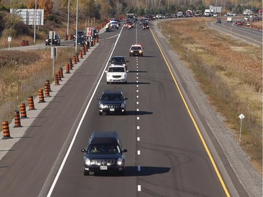 A procession transporting the body of Cpl. Nathan Cirillo travels along the Veterans Memorial Highway in Ottawa on Friday, October 24, 2014.