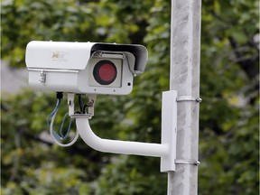 Installing fake traffic cameras not worth the effort, Otawa has conluded. (AP Photo/Mark Duncan)