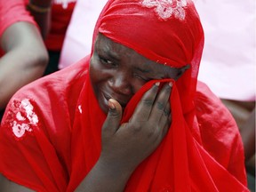 A woman attends a demonstration calling on the government to rescue the kidnapped school girls of a government secondary school Chibok, outside the defence headquarters in Abuja, Nigeria, earlier this year.  This is an example of the use of women and girls as weapons in war, including those conducted in the name of religion where sexual assault is seen as a way to humiliate the enemy.