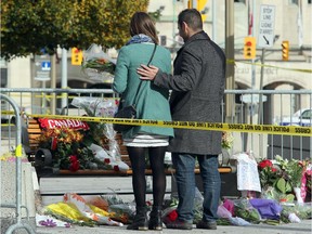 Although much of the area around the National War Memorial and Parliament is still blocked off with police barriers, people were allowed to pay their respects Thursday.