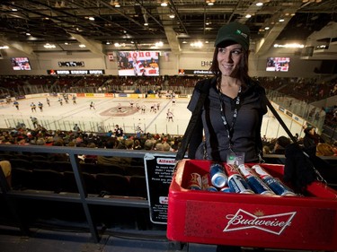 Angie Jodoin sells beer in the stands as the Ottawa 67's held their home opener in the renovated TD Place arena.