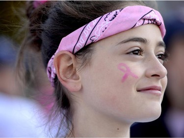 Ashlee Dory, 12, wears a face painted pink ribbon on her cheek at the start of the CIBC Run for the Cure in Ottawa on Sunday, October 5, 2014.