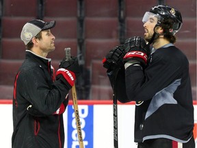 Senators Assistant Coach Jason Smith talks to Jared Cowen during a recent  practice.