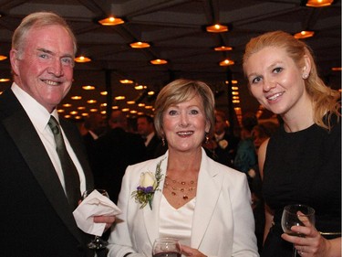 Bill Helmer with his wife, board member Jan Helmer, and Laura Dimic at Upstream Ottawa's Youth Matters Gala, held Thursday, Oct. 16, 2014, at the National Arts Centre.