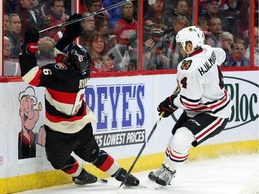 Bobby Ryan of the Ottawa Senators is tripped but no call on the play by Niklas Hhalmarsson of the Chicago Blackhawks during third period NHL action.