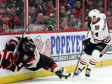 Bobby Ryan of the Ottawa Senators is tripped but no call on the play by Niklas Hhalmarsson of the Chicago Blackhawks during third period NHL action.