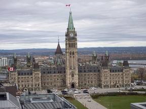 Centre Block on Parliament Hill in Ottawa is surrounded by police vehicles on on Wednesday, Oct. 22, 2014.