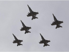 CF-18 Hornets fly in formation on departure from Cold Lake, Alta., on Tuesday. They are  to join the fight against the Islamic State of Iraq and Syria (ISIL).