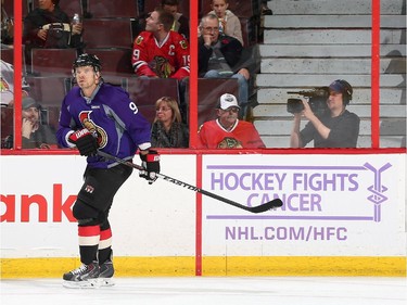 Milan Michalek #9 of the Ottawa Senators wears a purple jersey in support of Hockey Fights Cancer during the pre-game skate.