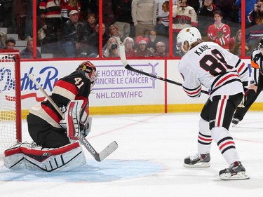 Patrick Kane #88 of the Chicago Blackhawks hits the crossbar on a shoot-out attempt against Craig Anderson #41 of Ottawa Senators.