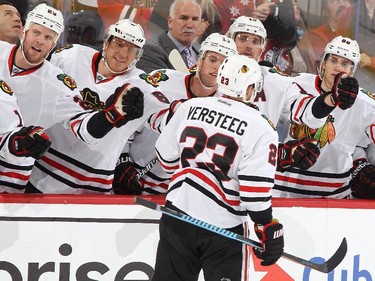 Kris Versteeg #23 of the Chicago Blackhawks celebrates his first period goal with team mates Bryan Bickell #29, Marian Hossa #81, Jonathan Toews #19, Patrick Sharp #10 and Patrick Kane #88.