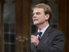 Citizenship and Immigration Minister Chris Alexander responds to a question during Question Period in the House of Commons Thursday September 25, 2014 in Ottawa.
