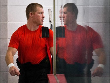 Chris Neil is reflected in the rink glass as the Ottawa Senators practice Wednesday afternoon at the Bell Sensplex.