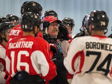 Coach Paul MacLean gives instructions to the team as the Ottawa Senators practice Wednesday afternoon at the Bell Sensplex.