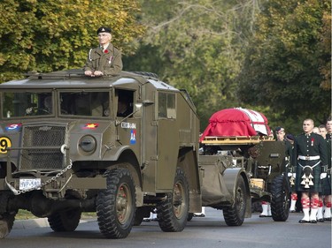 The casket of Cpl. Nathan Cirillo is towed during his funeral procession in Hamilton.