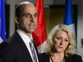 Canadian Public Safety Minister Steven Blaney and Quebec Public Security Minister Lise Theriault address reporters at a news conference in St-Jean-sur-Richelieu, Que on Tuesday Oct. 21, 2014. One of two soldiers hit by a car on Monday in Saint-Jean-sur-Richelieu, Que., died of his injuries early Tuesday, according to Quebec provincial police.