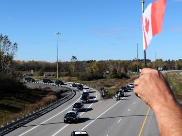 The body of Cpl. Nathan Cirillo is transported by hearse from Ottawa to Hamilton via the Highway of Heroes, October 24, 2014.