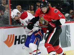 Darren Dietz, left, and Bobby Ryan battle along the boards in the first period as the Ottawa Senators take on the Montreal Canadiens in pre-season NHL action.