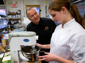 Dave Loan, (L) owner of ZenKitchen, has started an "emerging chefs" dinner series -- inviting in community cooks who are doing interesting vegan things to be guest chefs for one evening each. First in this series is Erika LeBlanc,17. She's seen making salty butterscotch sauce.  Assignment 118590 // Photo taken at 16:14 on October 7, 2014. (Wayne Cuddington/Ottawa Citizen)