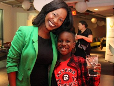 Denise Siele with her son, Fred Sherman III, at the inaugural HERA Mission charity gala in support of widows and orphans in western Kenya, co-hosted by the Ottawa Redblacks CFL team at the TD Place on Wednesday, Oct. 15, 2014.