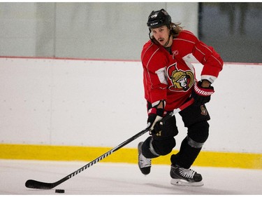 Erik Karlsson makes a pass as the Ottawa Senators practice Wednesday afternoon at the Bell Sensplex.