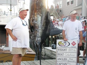 A Carleton biologist wants fish tournaments to measure winning fish by length, not weight, a change that would make it easier to catch and release trophy fish like this 883-pound blue marlin.