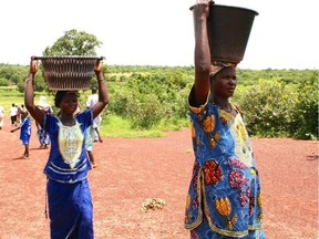 The Swedish military has published a gender guide to help officers on decisions they make, both at home and during overseas operations. The guide would take into account the effect decisions have on women during international missions. In this photo, women in Mali carry water and food.