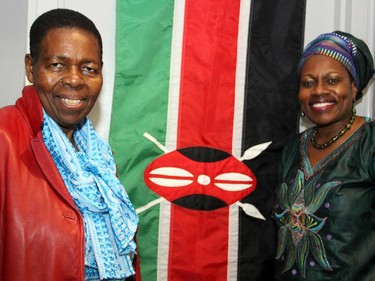 From left, Beatrice Osome and Sarah Onyango, with their native flag of Kenya, at the inaugural HERA Mission charity gala in support of widows and orphans in western Kenya, co-hosted by the Ottawa Redblacks CFL team at the TD Place on Wednesday, Oct. 15, 2014.