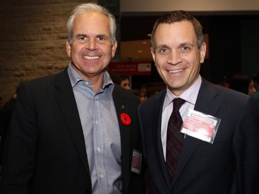 From left, Ottawa Police Chief Charles Bordeleau with broadcaster and columnist Mark Sutcliffe, co-chair of the 2014 United Way Ottawa Community Campaign, at Schmoozefest 2014,