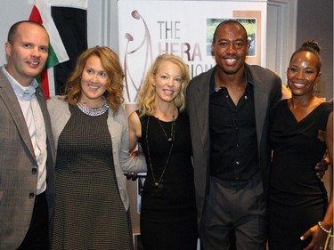 From left, Redblacks coach Rick Campbell with his wife, Jeri, HERA Mission founder Peggy Taillon, Redblacks QB Henry Burris and his wife, Nicole, and Shawn Simpson from TSN 1200 at the inaugural charity gala in support of widows and orphans in western Kenya held at the TD Place on Wednesday, Oct. 15, 2014.