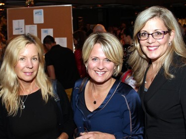 From left, Sandra Abma and Lucy van Oldenbarneveld, both from CBC News Ottawa, with Susan Smith, a principal at Bluesky Strategy Group, at the Ottawa film premiere of Elephant Song at the National Arts Centre on Monday, Sept. 29, 2014.