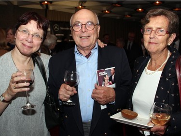 From left, Sylvie Doucet and Raphael Girard with Allison Dingle, volunteer chair of fundraising for the Ottawa Symphony Orchestra, at the orchestra's Fanfare post-concert reception held Monday, Oct. 6, 2014, at the National Arts Centre.