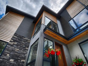 Maple Leaf Homes chose a bold mix of materials on a modern design for this custom home.