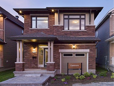 Richcraft’s award-winning Canmore offers both ornamental roof brackets and double porch columns as part of its mixed Craftsman-urban vibe.