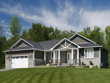 An award-winning production bungalow by Greenmark Builders of Greely spotlights attention to front porch detailing.