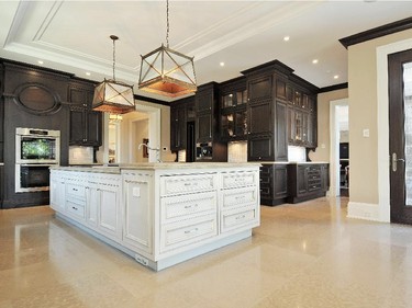 The elegant kitchen opens to a bright breakfast room.