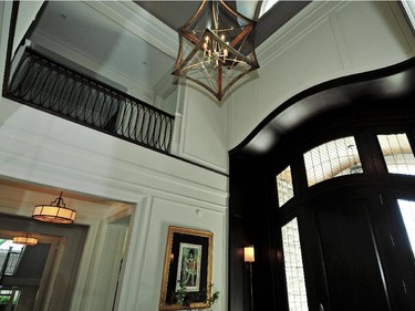 In the foyer, soaring ceilings and elaborate detailing set the tone for the home’s interior.
