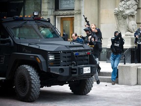 General Tom Lawson being escorted out of building on Sparks Street near  the Post Office.