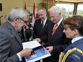 Gert (Gerry) van 't Holt, left, meets Gov. Gen. David Johnston in the Netherlands in 2013.