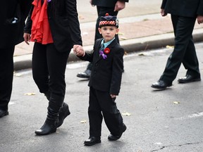 Marcus, the son of Cpl. Nathan Cirillo walks in the funeral procession heading into Hamilton's Christ's Church Cathedral, Monday October 28, 2014.