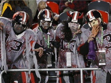 Fans dressed as zombies prior to the start of a CFL game between the Ottawa Redblacks and the Hamilton Tiger-Cats.