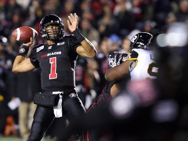Henry Burris of the Ottawa Redblacks throws against the Hamilton Tiger-Cats during first half CFL action.